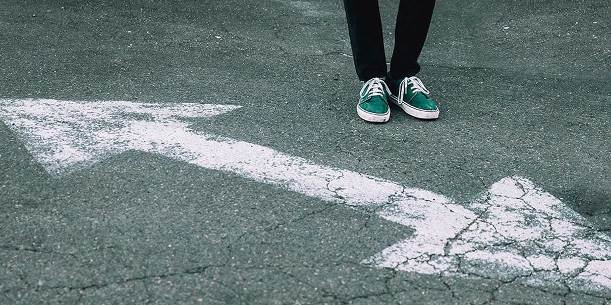 arrows pointing in opposite directions, a person in process of making a decision