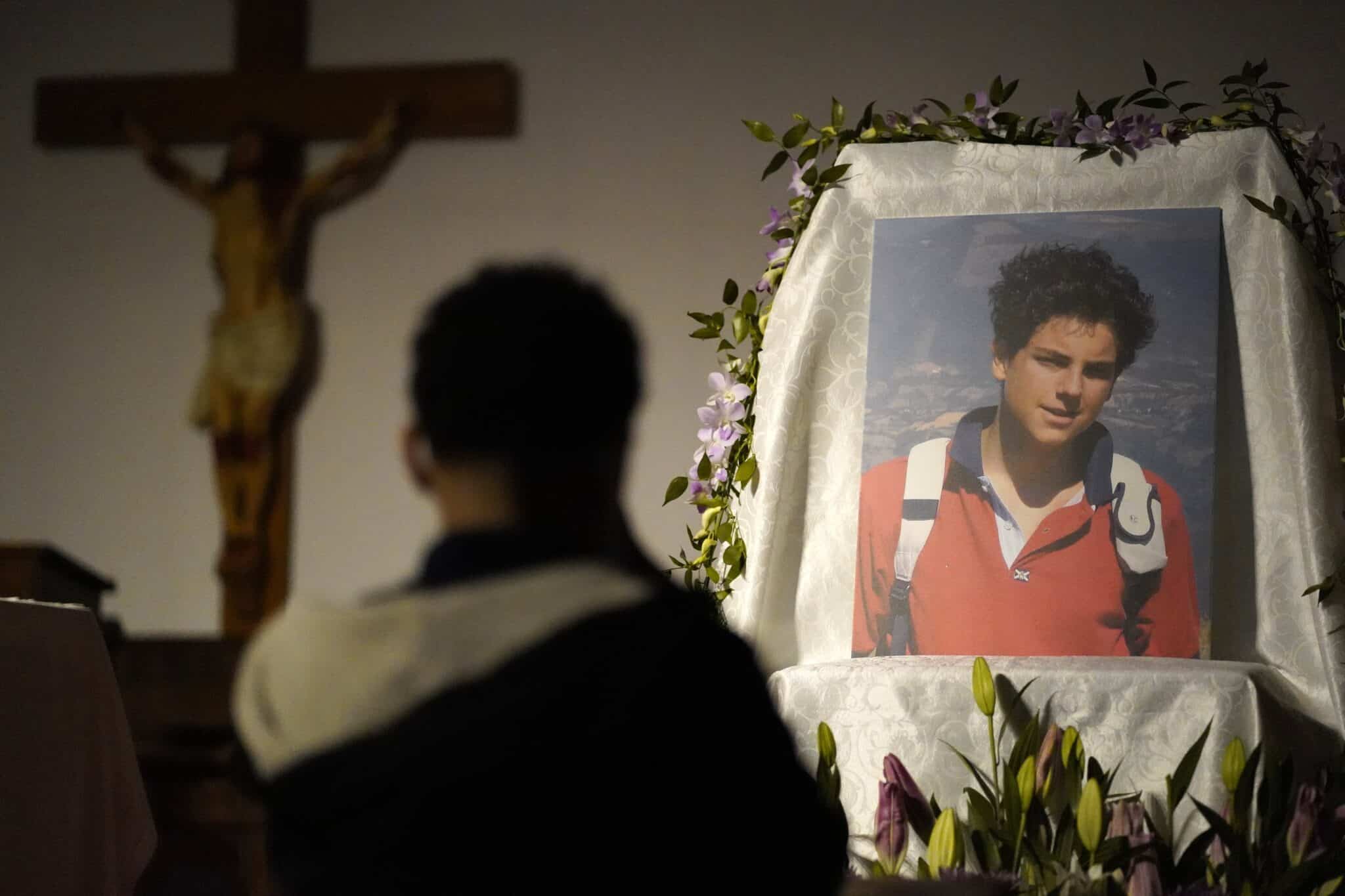 A boy kneels in prayer before an image of Blessed Carlo Acutis during eucharistic adoration April 7, 2022, at St. Rita of Cascia Church in the South Bronx, N.Y. (OSV News photo/Gregory A. Shemitz, CNS)