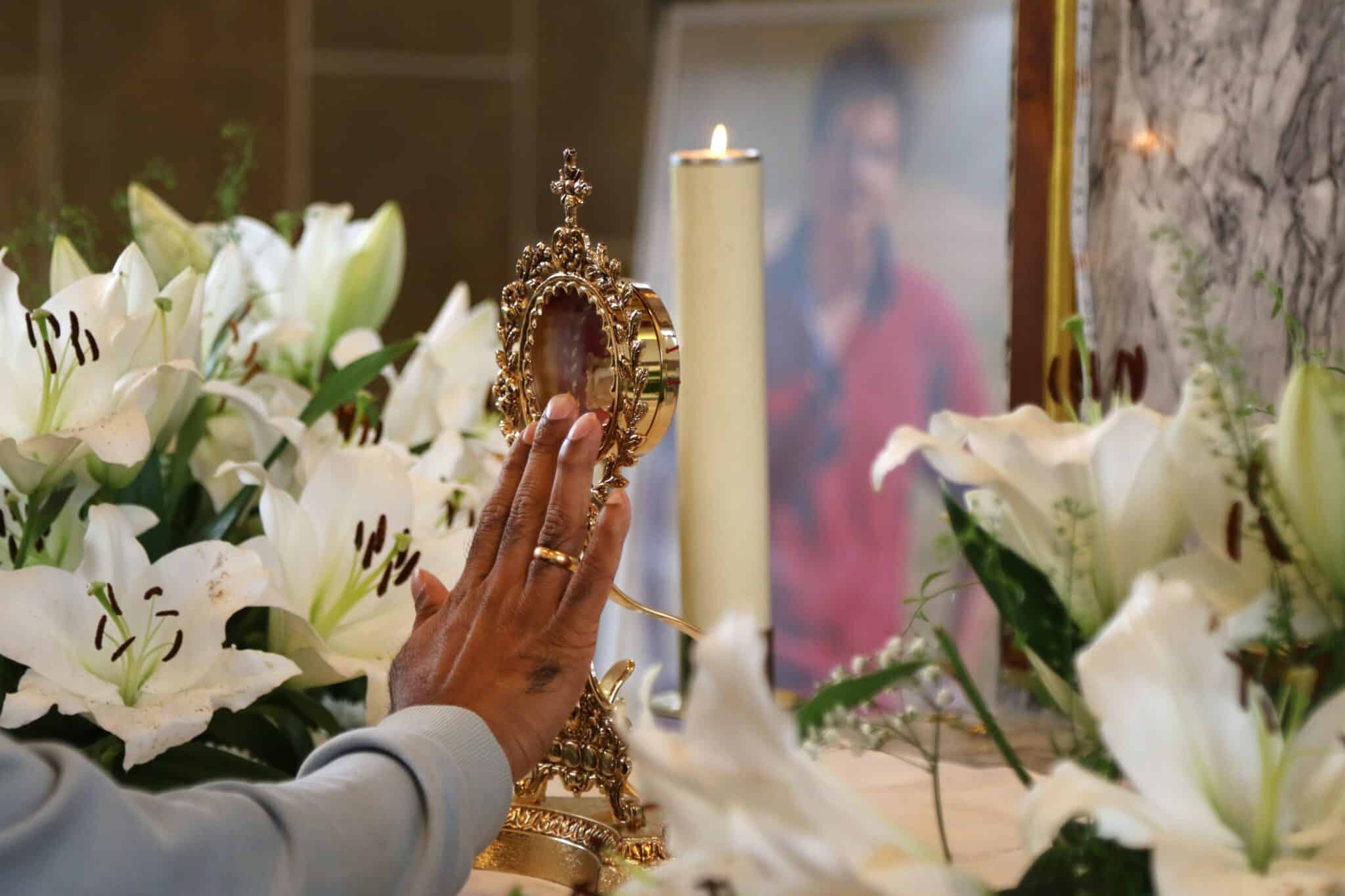 A pilgrimage touches the reliquary containing a relic of the heart of Blessed Carlo Acutis during Sept. 21, 2024, public veneration at St. Anthony’s Church in Manchester, England. The relic of Blessed Carlo, who will be canonized in 2025, attracted more than 5,000 pilgrims during a Sept. 20-23 visit. (OSV News photo/Simon Caldwell)